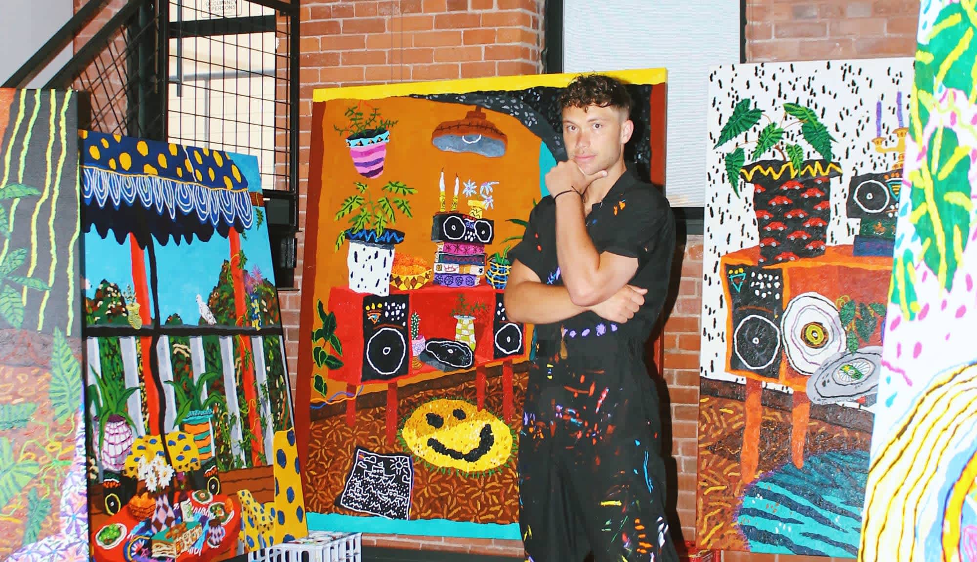 Artist Cooper stands with his colourful stereo images, famous paintings inspired by music..