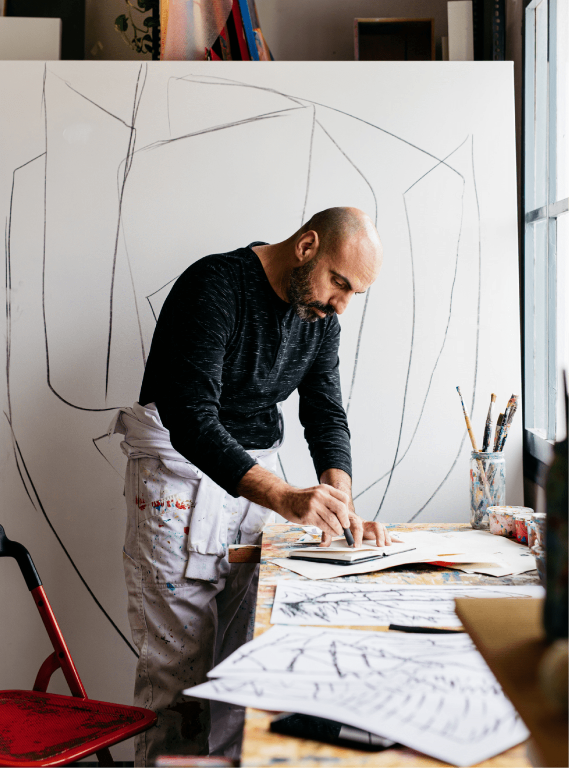 Artist writing in studio