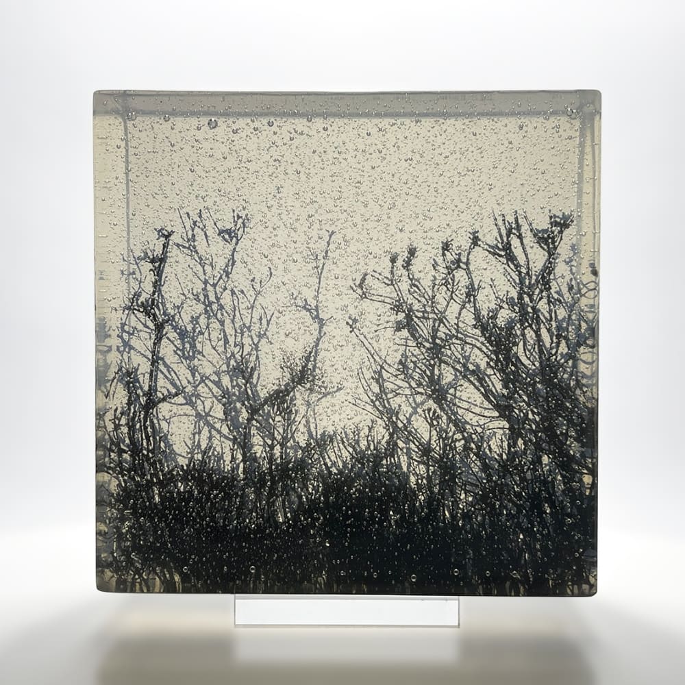 Helen Slater glass block with opaline and black drawing cast in centre.