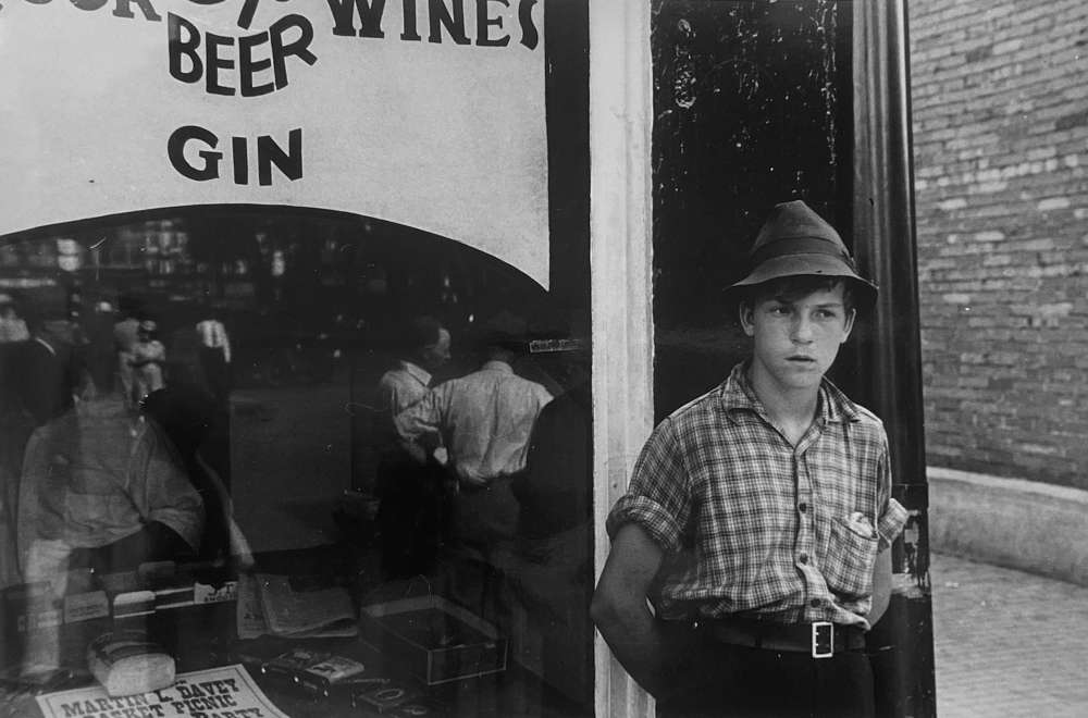 Ben Shahn, Boy in front of liquor store, Newark, Ohio, 1938