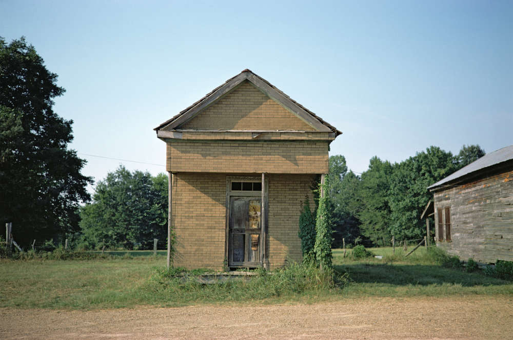 William Christenberry, Building with False Brick Siding, Warsaw, Alabama, 1974