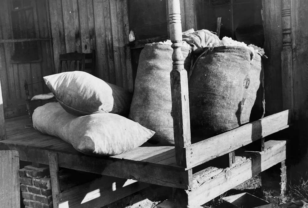Marion Post Wolcott, Sacks of cotton on wagehand's porch, Knowlton Plantation, Perthshire, Mississippi Delta, Mississippi, 1939