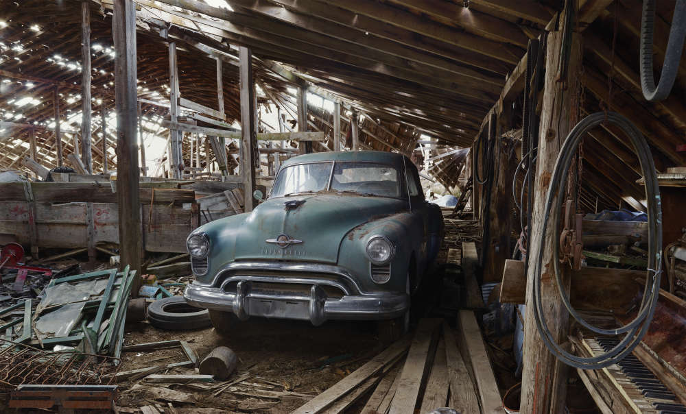 Andrew Moore, Oldsmobile in Barn, 2011