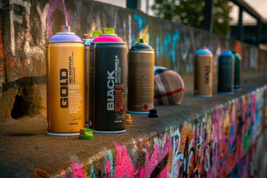 Spray cans on a wall