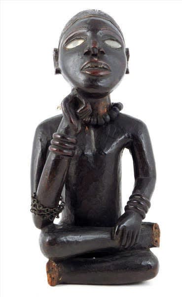 A seated Yombe figure. Height: 30 cm. Provenance: John Vernon – Putney, November 1964 & Ernst Ohly, Berkeley Galleries, London. Image courtesy of Woolley & Wallis.