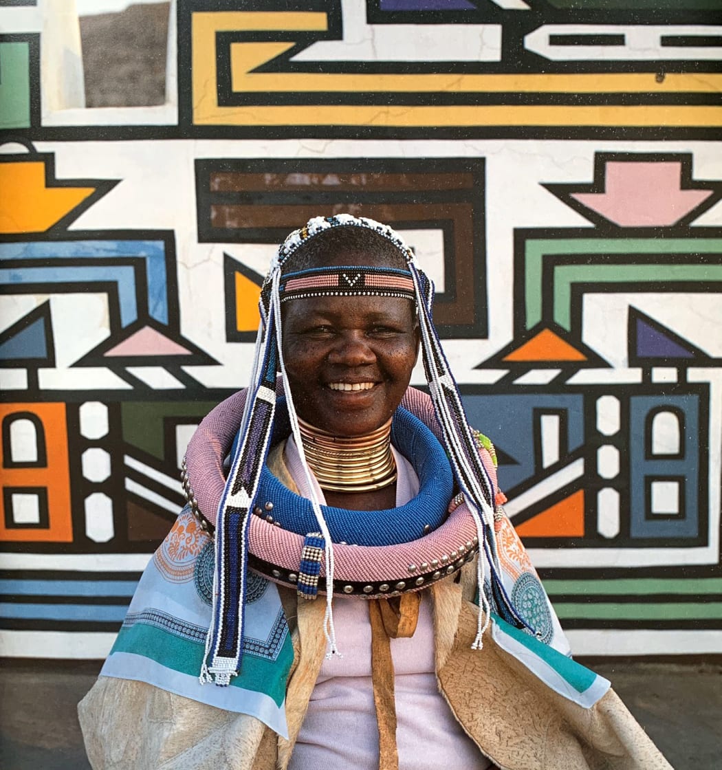 Franzina Ndimande wearing a goatskin cape, called a linaga, and beaded neck hoops, isigholwani. Image courtesy of Margaret Courtney-Clark.