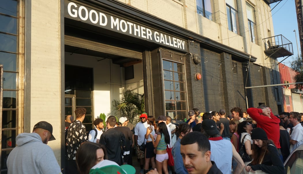photo of the outside of the gallery with a crowd of people waiting