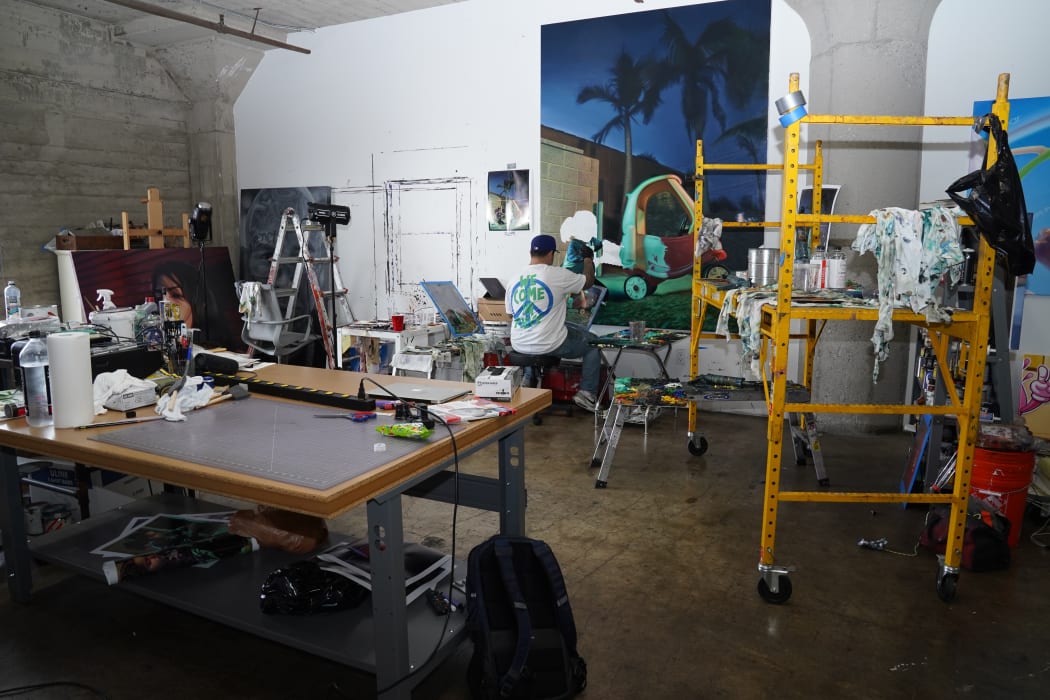 photo of the artist working in their studio