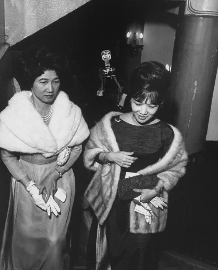 Pham Khac Hy & Madame. Ngo Dinh Nhu, leaving a theater.