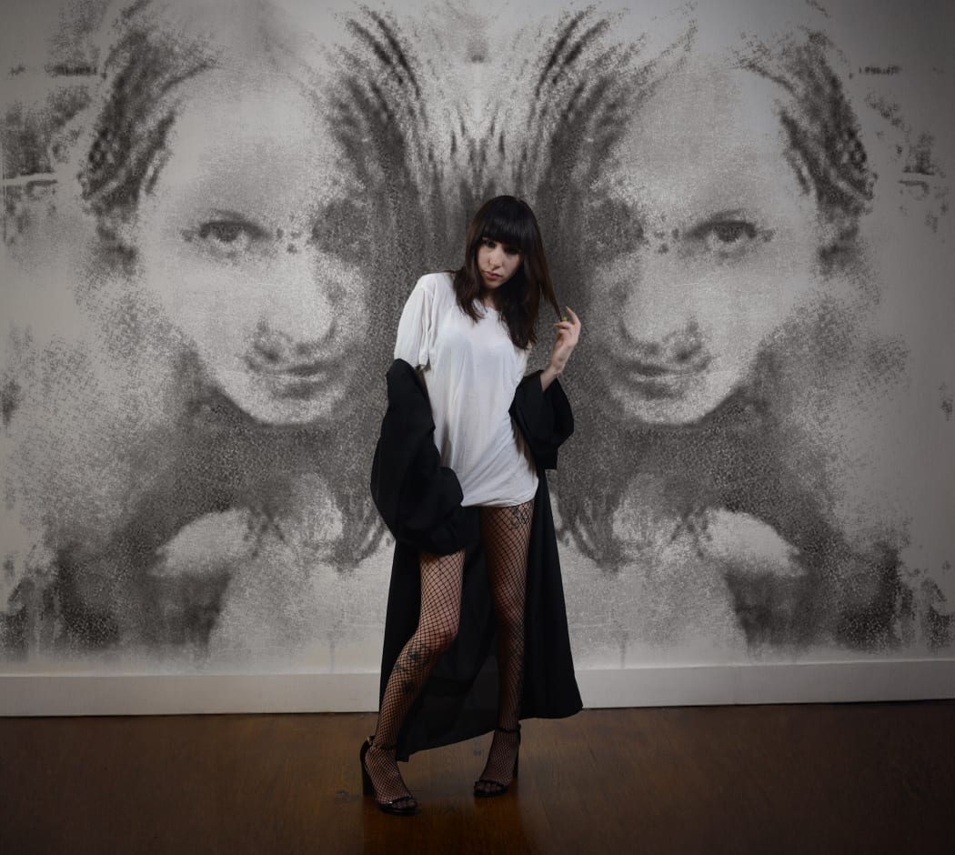 Danka Latorre pictured in front of her work taken by Jacob Ace.