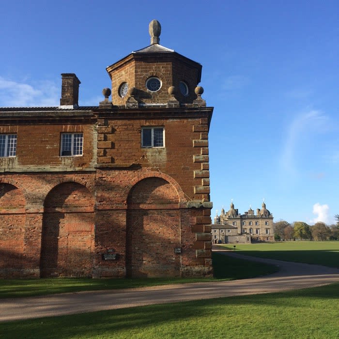 The stable block with the main house beyond, Houghton Hall