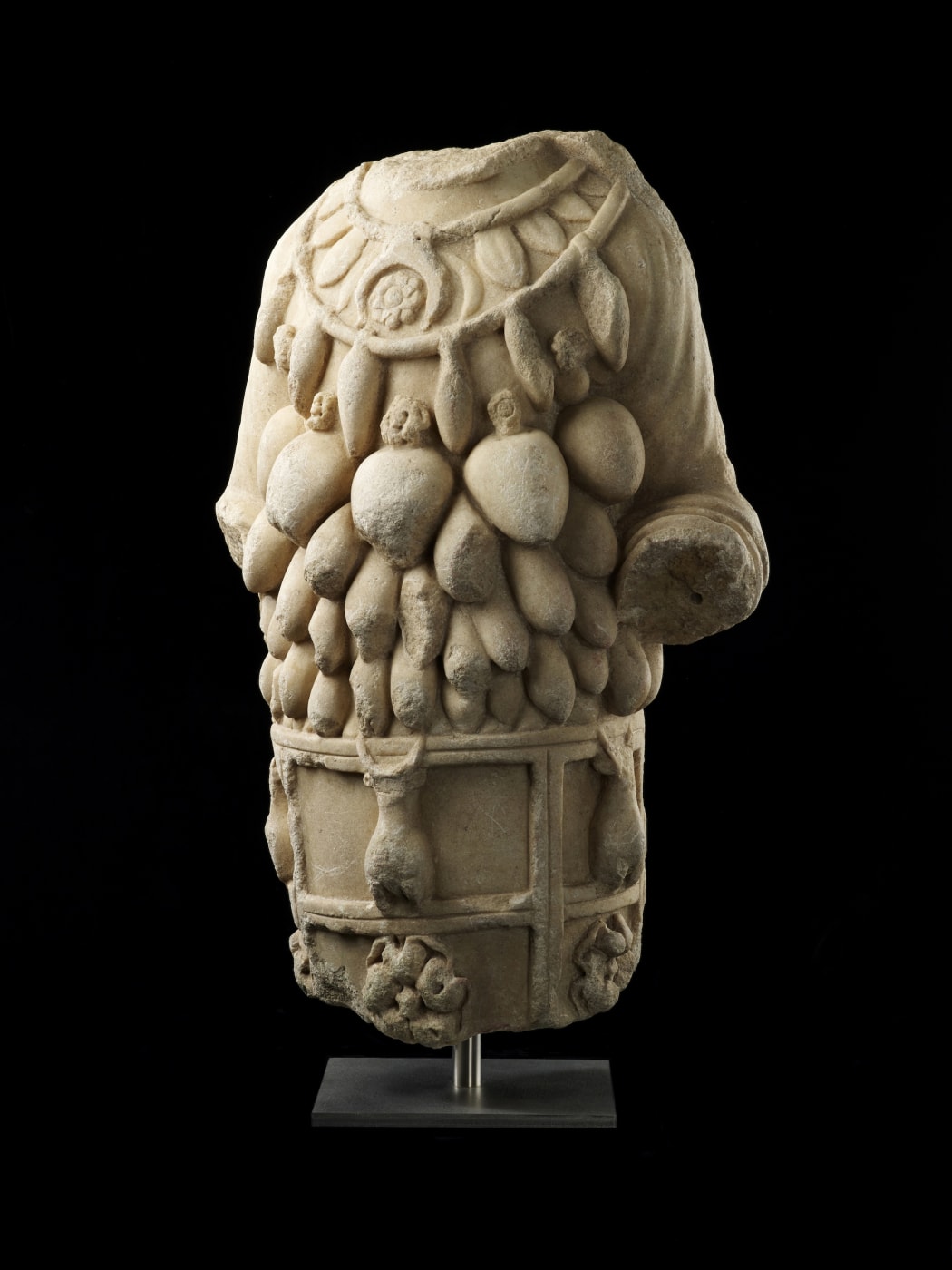 A ROMAN MARBLE TORSO OF ARTEMIS OF EPHESUS, Circa 1st century AD