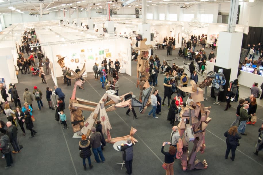 Photograph of an art convention showcase.