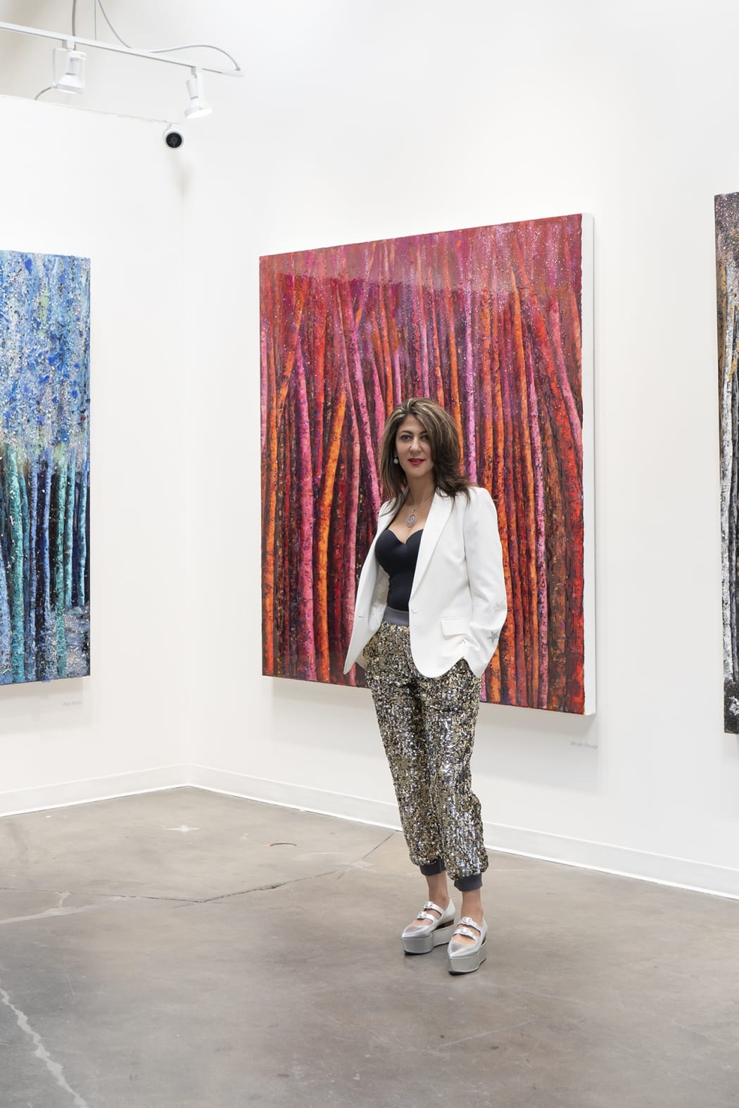 Haleh Mashian in front of her LUSTER paintings