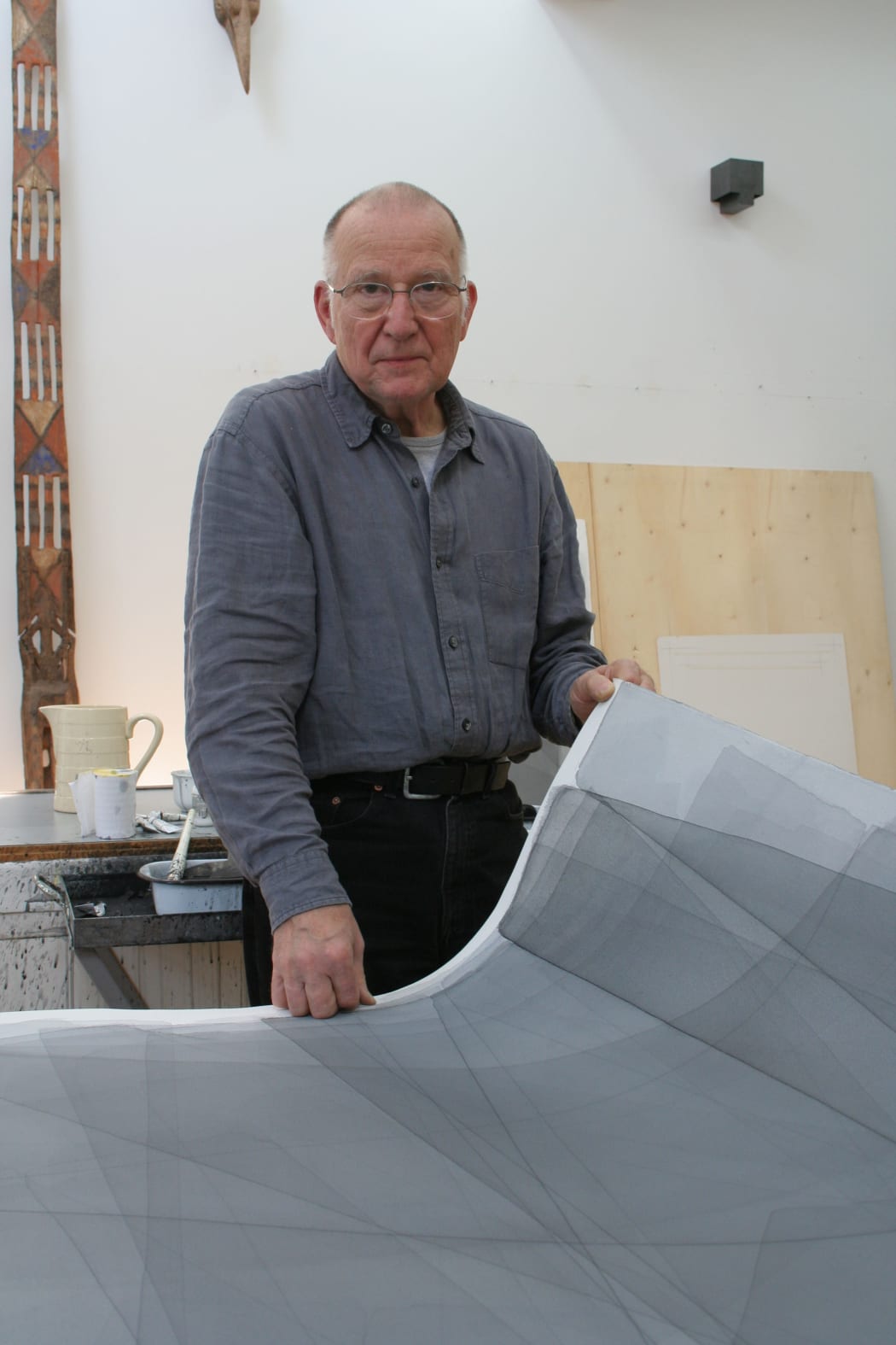 Joachim Bandau in studio with one of his watercolours, photographed by Antje Bandau