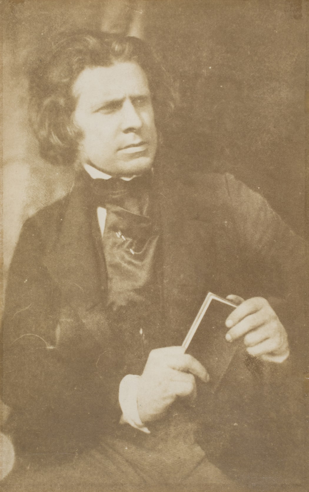 Robert Adamson (1821-48), D O Hill RSA seated with a book, calotype print, around 1843-48, gifted by D O Hill, around 1852.