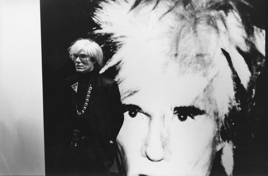 Andy Warhol at the opening of his Self-Portraits exhibition, Anthony d’Offay Gallery, London, July 1986. Photograph by John Wildgoose. © John Wildgoose / The Andy Warhol Foundation for the Visual Arts.