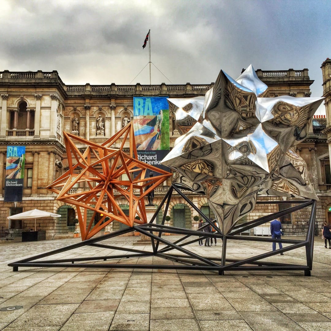 Courtyard sculpture by Frank Stella Hon RA - Royal Academy of Arts - London "Courtyard sculpture by Frank Stella Hon RA - Royal Academy of Arts - London" by pobre.ch is licensed under CC BY 2.0. Taken on April 16, 2015