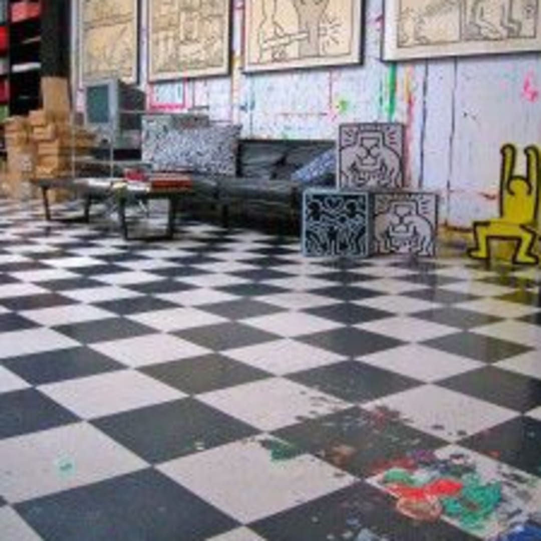 A view of Keith Haring’s studio, serves the office for the Keith Haring Foundation. The Foundation has preserved the paint on the floor and walls. (Photo by Michelle Aldredge. Artwork © Keith Haring Foundation)