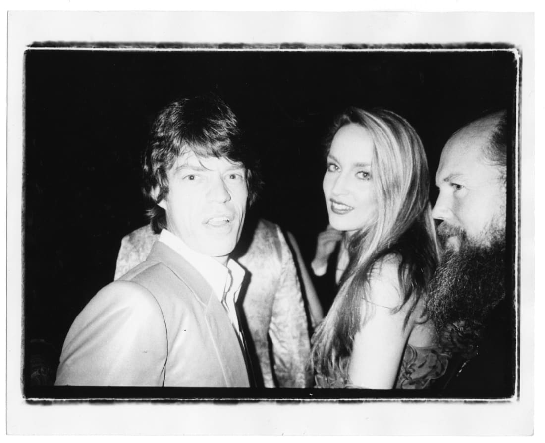 Bob Colacello, Mick Jagger, Jerry Hall, and Garech Browne, Red Ball, Paris, 1980. Vintage gelatin silver print. 20,3 x 25,4...