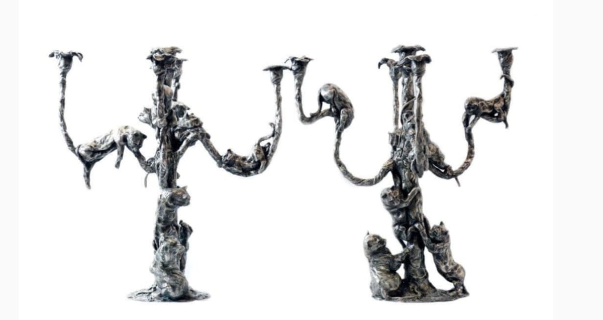 Pair of French silver plated bronze five light candelabra with panthers