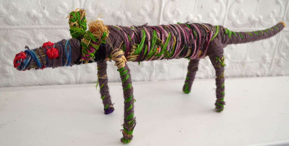 Pauline Minmila Wangin Tinka (lizard) raffia and minarri (greybeard) grass and wool 20 x 76 x 15 cm