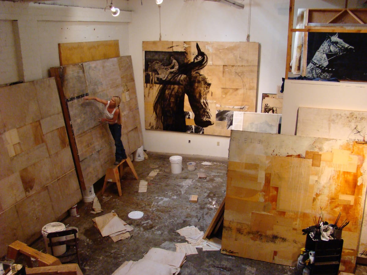 Artist, Ashley Collins, in her studio
