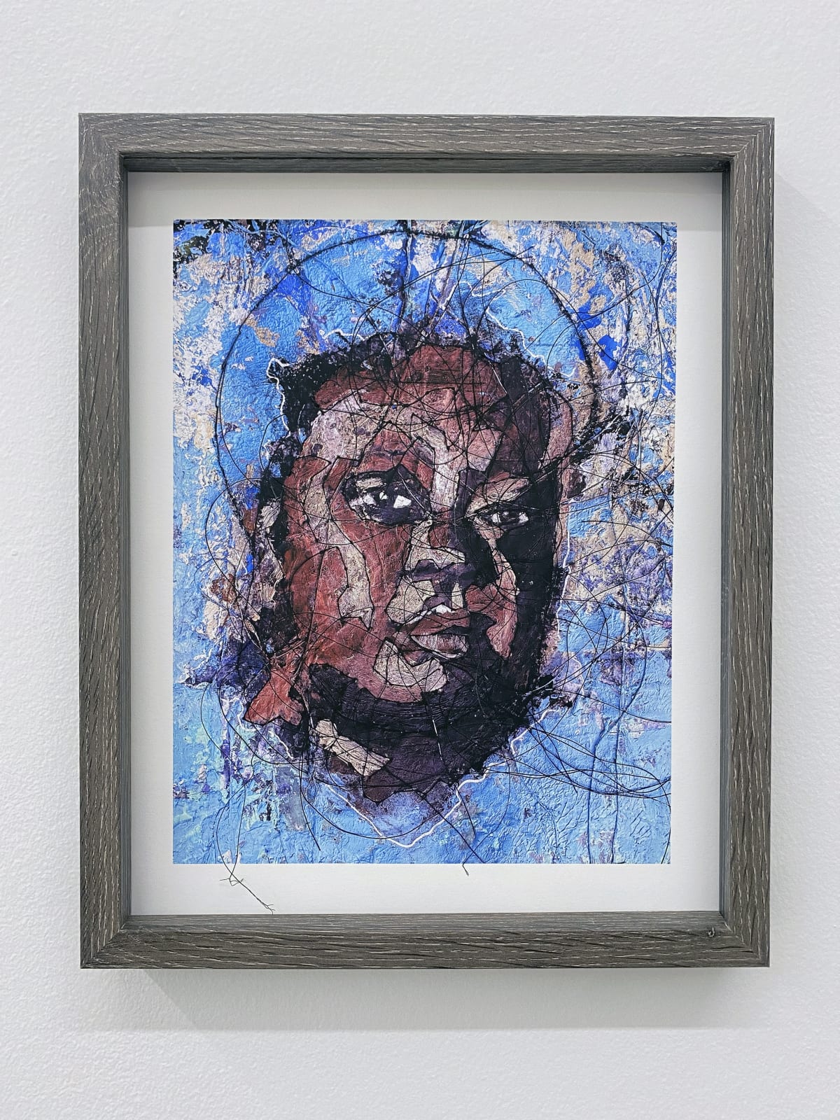 Detail view of female head with threads sewn into paper