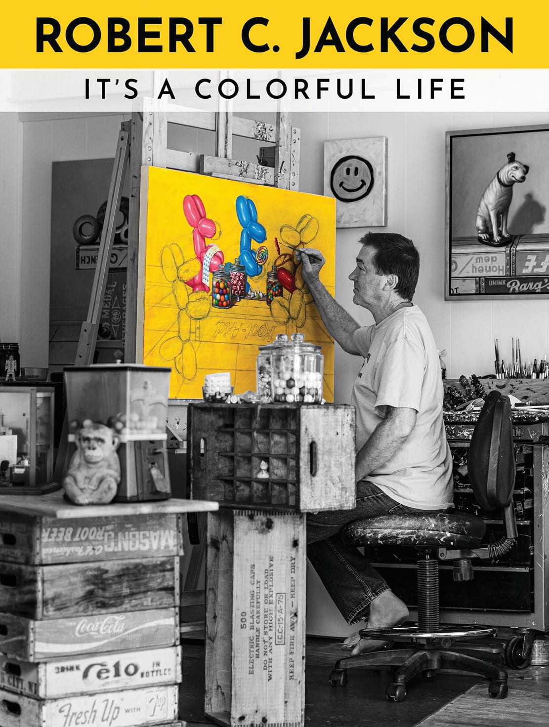 Photo of a man painting in his studio.