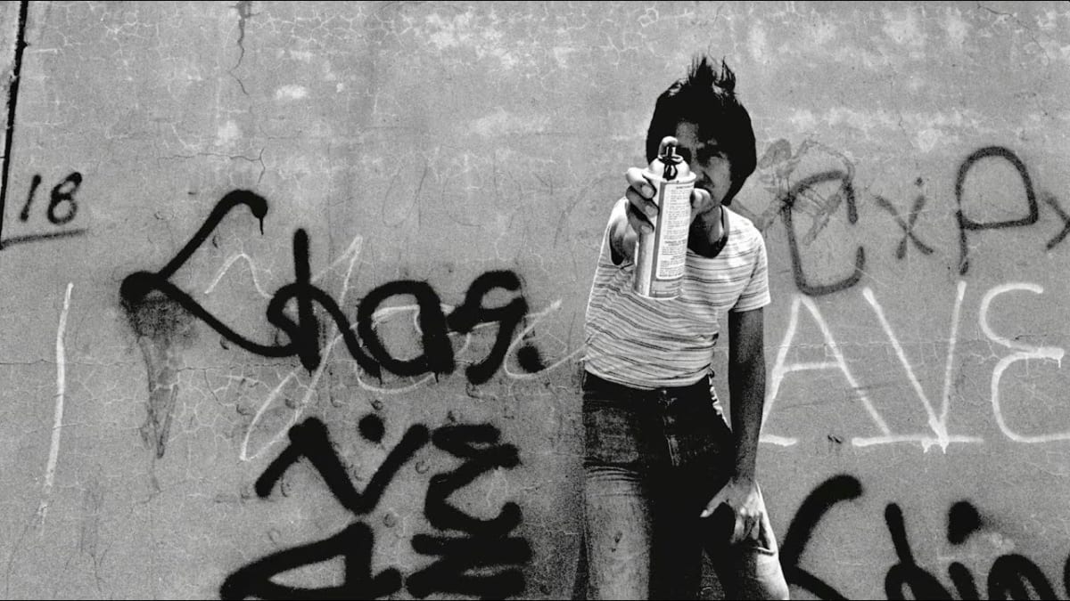 Graffiti artist in New York City in the 1970s with a spray paint can.