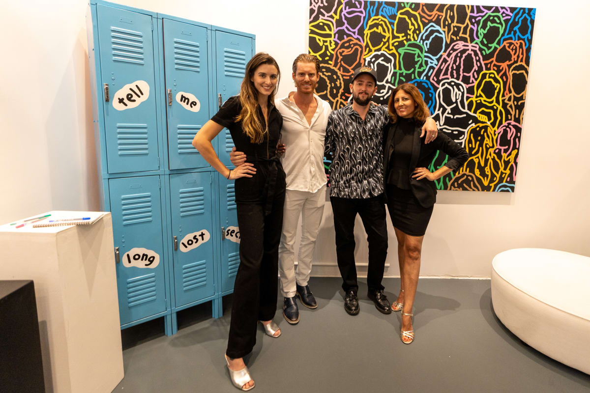 People at Carousel Fine Art's gallery space in Miami, FL during Chance Cooper's Spotlight Exhibition, "Between Me and You."