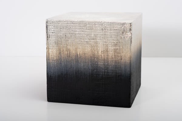 An artwork by Miya Ando showing a wood cube with a gradient of black to white 