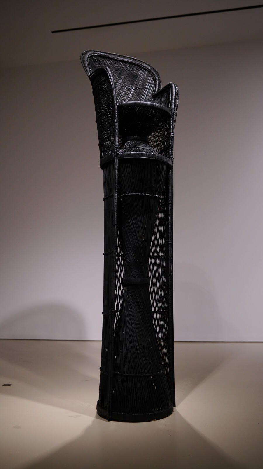 Esmaa Mohamoud, A Seat Above the Table (Warren Moon), 2019, found rattan peacock chair, rattan, paint, tape, plastic, adhesive, nails, 290 × 66 × 66 cm. Courtesy of the artist.