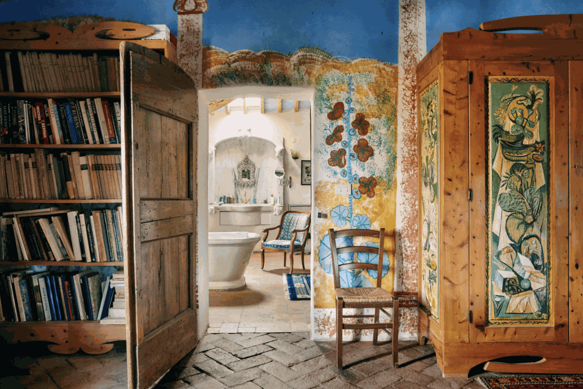 The master bedroom, with colourful frescoes and furniture painted by Gorky, looking into the bathroom © Stefan Giftthaler