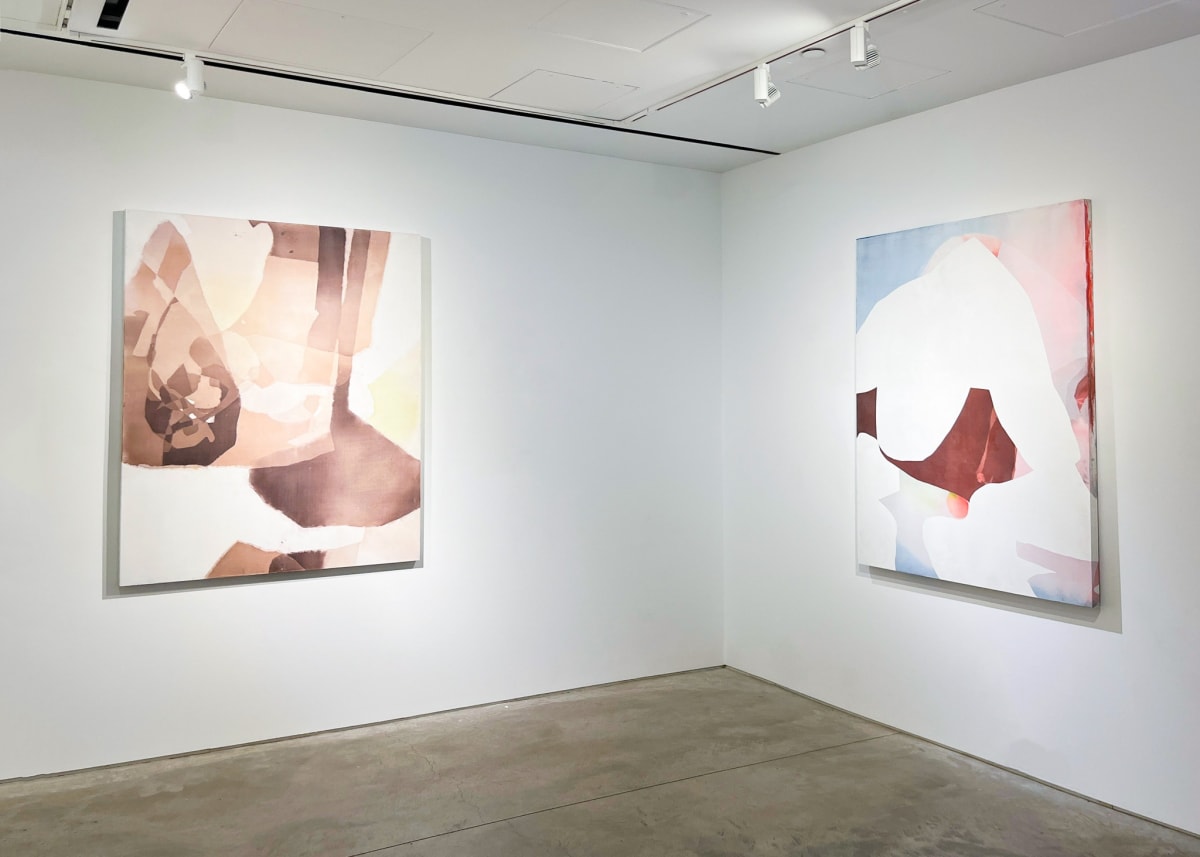Abstract paintings by Eric Blum on display.