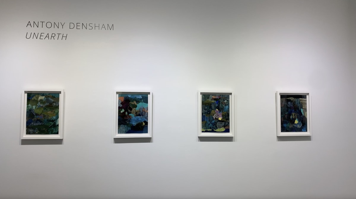 Gallery wall with four framed abstract paintings