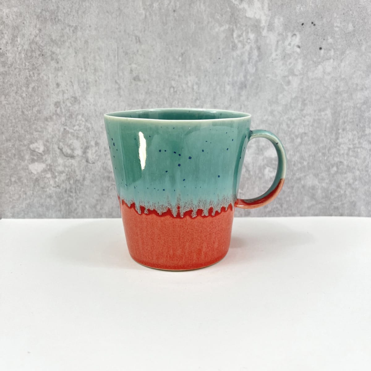 Yuta Segawa ceramic mug in two tone glaze of duck egg blue and coral