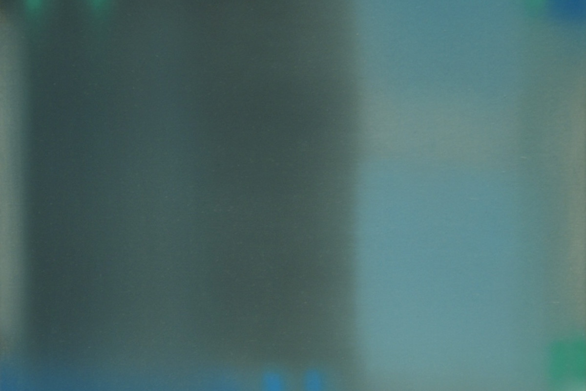 Oil painting on panel by Julian Jackson in various muted shades of blue and green. From a viewer's perspective, the painting is a texture pattern that resemble shadows that are out of focus. This creates an illusion of form.