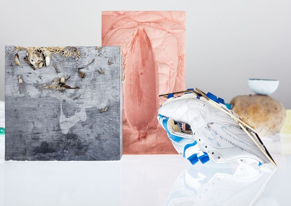 Various indeterminate objects on a white reflective surface
