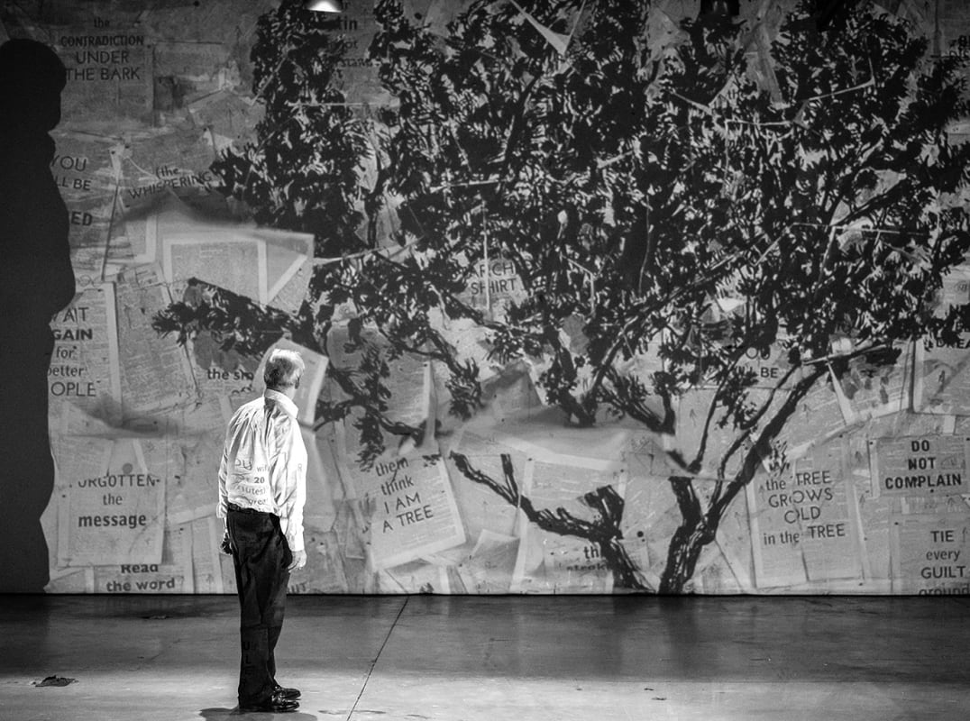 William Kentridge looking at a full-size rendering of his work.