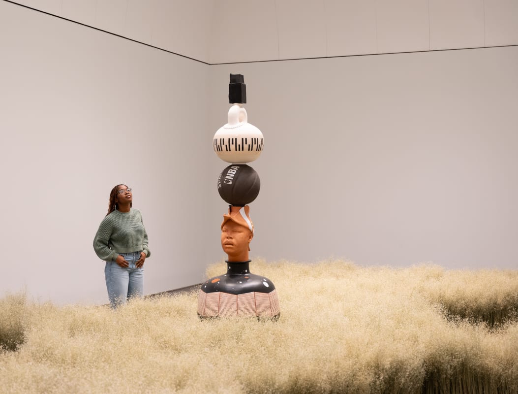 Visitor in Tavares Strachan: Between Me and You at the Blanton Museum of Art, The University of Texas at Austin, November 9, 2024–June 1, 2025