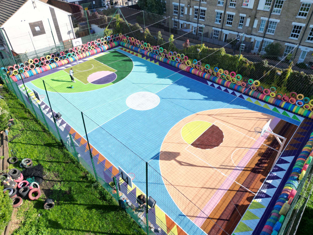 Basketball court created by Alvaro Barrington A unique and vibrant community court for Tower Hamlets