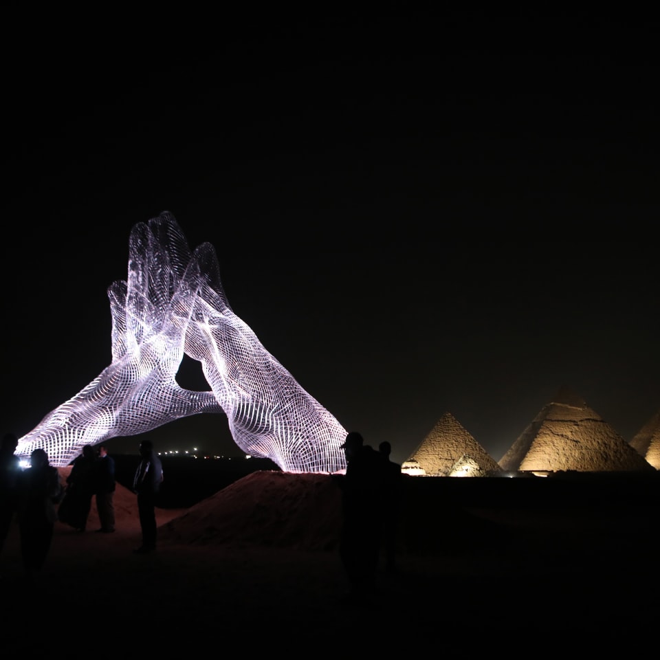 Larger-than-life sculptures by Giza pyramids Reuters