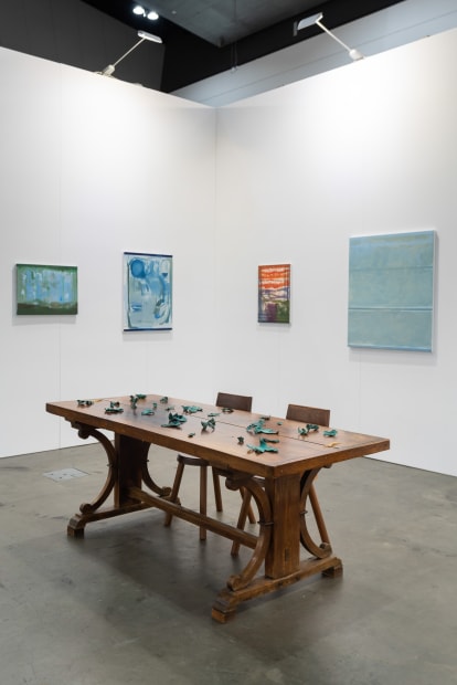Installation view with works by Sandra Bushby & Cindy Huang. Sumer, Booth H2, Melbourne Art Fair. Photo: Phoebe Powell Normandy farmhouse kitchen table (circa 1850) courtesy of Miguel Meirelles Antiques; Alpine chairs from Laker Studio.