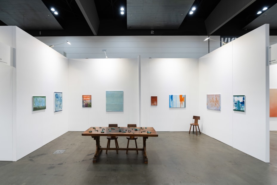 Installation view with works by Sandra Bsuhby & Cindy Huang. Sumer, Booth H2, Melbourne Art Fair. Photo: Phoebe Powell Normandy farmhouse kitchen table (circa 1850) courtesy of Miguel Meirelles Antiques; Alpine chairs from Laker Studio.