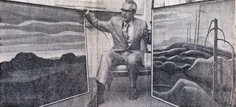 Walter Klinkhoff with two Lawren Harris canvases