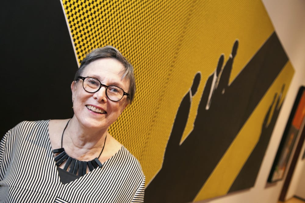 Idelle Weber in front of Munchkins I, II, & III at the Friends of Museum Reopening Preview. May 8, 2014. Photo by Charlie Gunter.