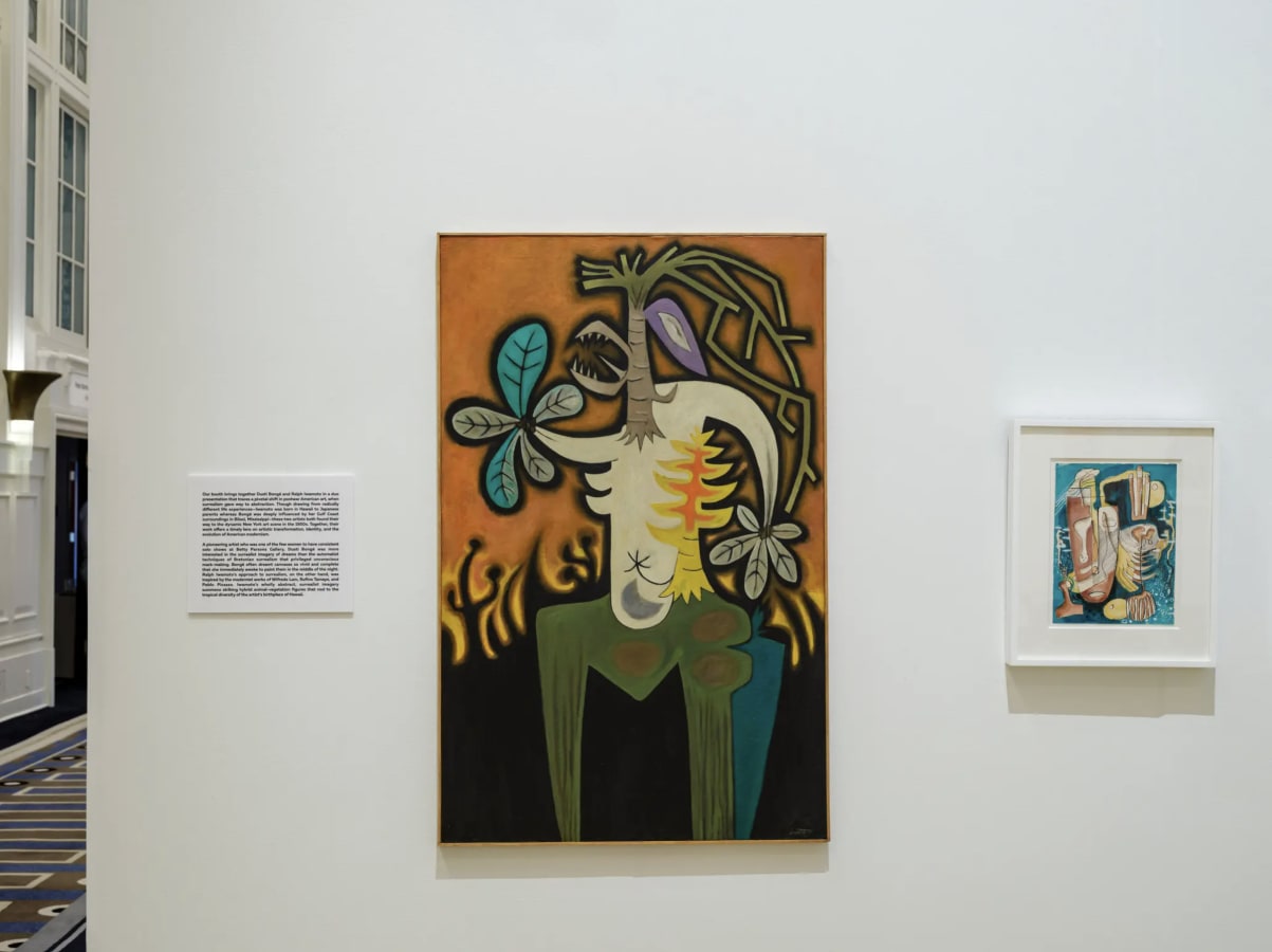 The Hollis Taggart booth includes Ralph Iwamoto’s “Wild Growth” (1955), oil on canvas Taggart),” center. At right is Dusti Bongé’s “Untitled (Surrealist Composition with Mask and Fish Skeleton),” c. 1950. Mixed media on paper.Credit...Karsten Moran for Th