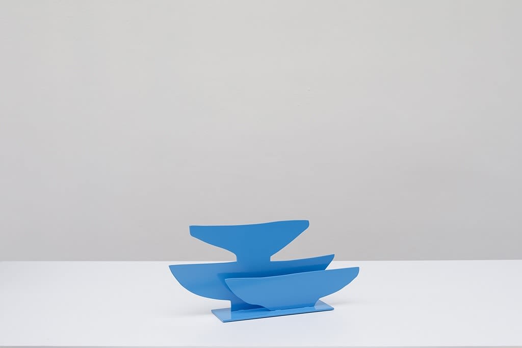Metal sculpture of three blue plates