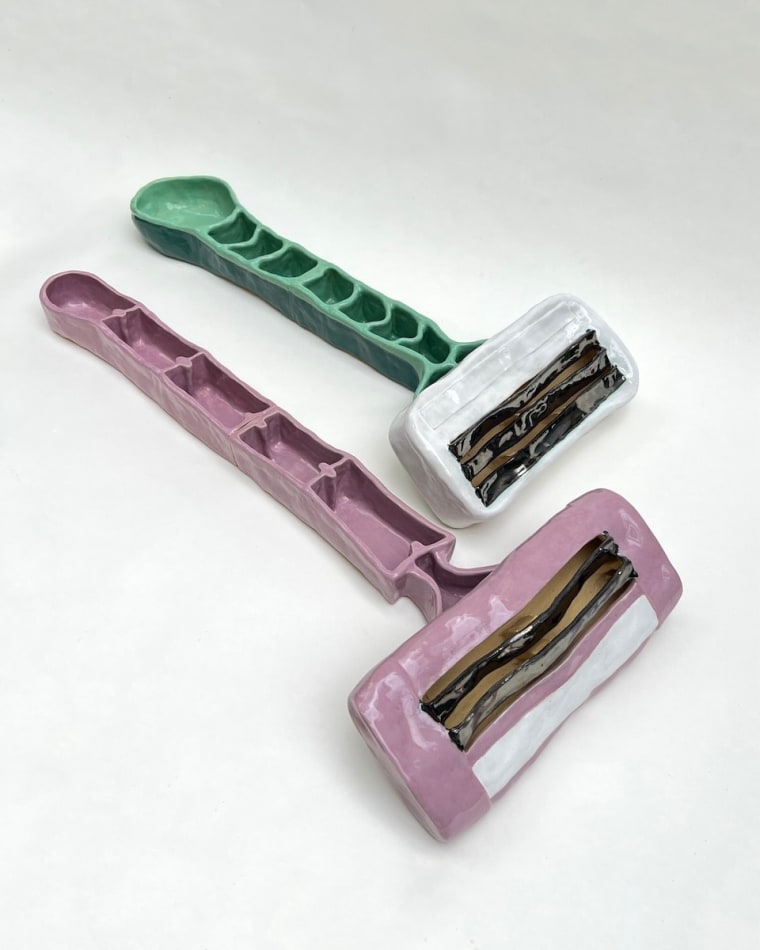 Annie Duncan - ceramic sculpture of a pair of razors in pink and mint green.